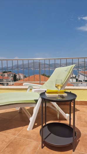 Lounging on the sunny all day balcony.