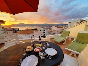 Sun loungers and beds on terrace