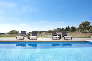 The pool terrace is equipped with high quality sun beds.