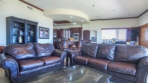 Leather sofas in dark brown add a rich touch to the decor.