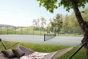 Tennis court overlooking a horse farm with breath taking views and sunsets