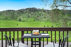 Enjoy a delicious meal on the elevated deck with gorgeous views of the Foothills!