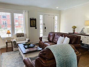 In the living room, relax on the leather sofa and recliner….