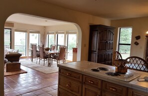The kitchen looking towards the sunroom dining area