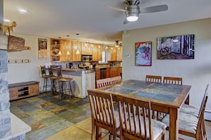 Spacious kitchen, with dining table and fireplace