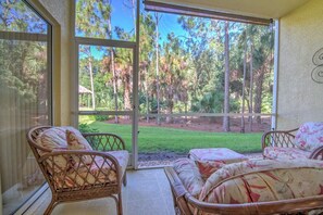 The Covered and Screened Lanai w/ Preserve and Tiki Hut Views