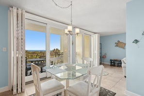 Glass Topped Dining Table Offering Seating for Six
