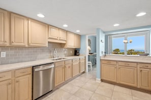 Fully Equipped Kitchen with Granite Counters and Stainless Steel Appliances