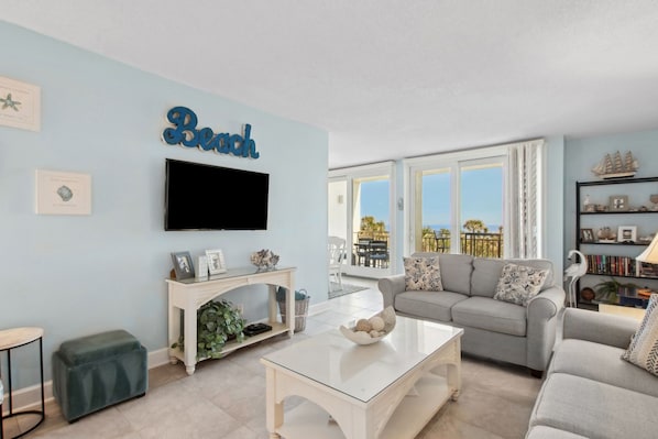 Living Area with Sofa, Loveseat, Flat Screen Smart TV, and Gorgeous Oceanfront Views