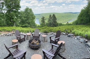 Fire circle with 5 Adirondack chairs, 5 treated stumps and a fire pit