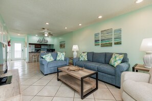 Open-concept living space featuring contemporary furnishings and bathed in natural light