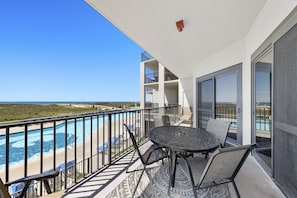 Beautiful sun drenched Private Balcony Overlooking the Pool and the Gulf of Mexico