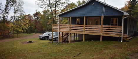 Exterior and fire pit, view of the house from the woods