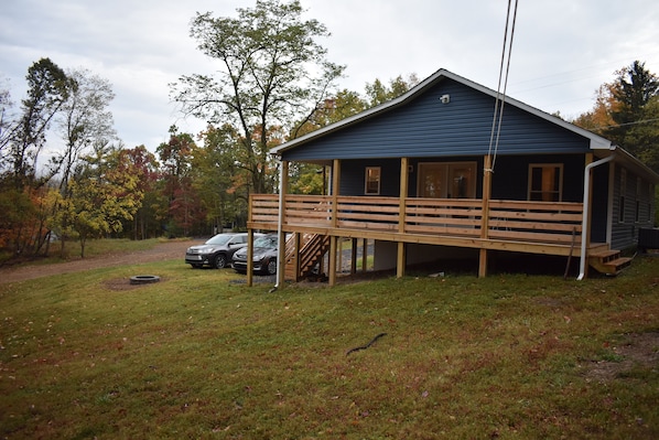 Exterior and fire pit, view of the house from the woods