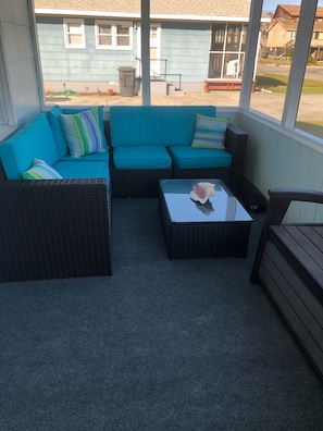 New cushions and carpet on front porch.