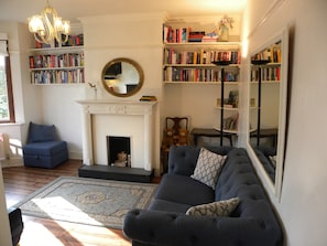 The lounge:  The books are for your enjoyment. Sofa converts to a double bed.