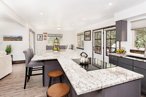 Kitchen with view of breakfast bar