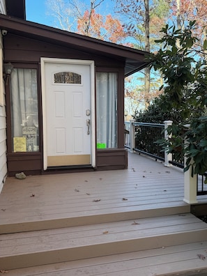 Front door with decking leading to the back deck.