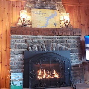Propane fireplace - warms the room and has a nice ambiance. New lamps (2022).