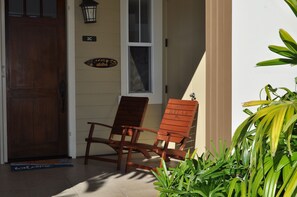 Front door with Tommy Bahama RELAX chairs to enjoy the landscaping 