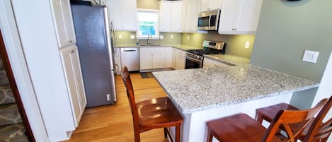 Welcome to your well-stocked gourmet kitchen with granite countertops!