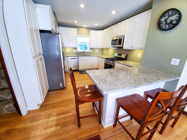 Welcome to your well-stocked gourmet kitchen with granite countertops!