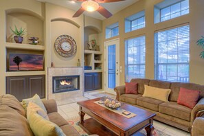 Large and comfortable great room has  spacious windows with view of the exciting backyard oasis. Fireplace does not work.