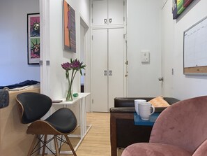 Extra high ceilings with fun art work and comfortable stylish furniture. 