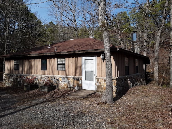 Front of the cabin, front door, kitchen window, bathroom and bedroom windows.