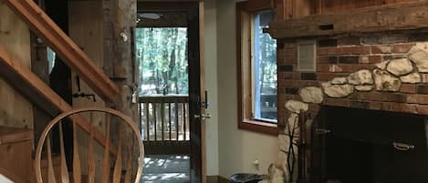 Rustic contemporary with field stone foyer and working fireplace