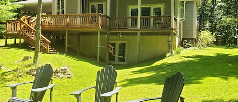 Private and quite back yard - all weather adirondack chairs around fire pit