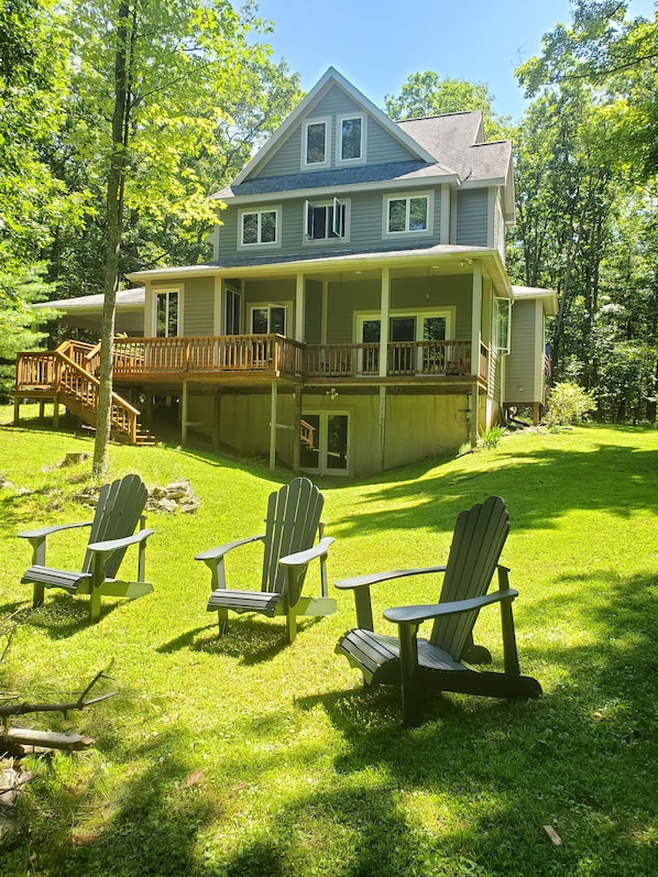 Private and quite back yard - all weather adirondack chairs around fire pit