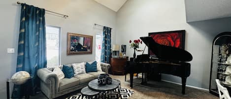 Vaulted ceiling with skylights & Grand Piano