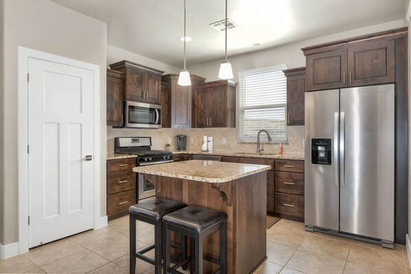 Fully stocked gourmet kitchen featuring all the comforts of home