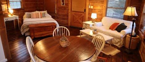 Living/Dining/Bedroom studio apartment-log cabin style. 