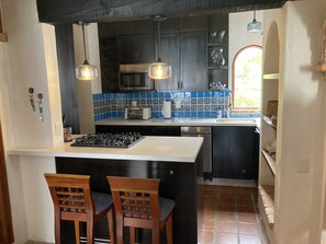 Newly remodeled kitchen with dishwasher and gas cooktop