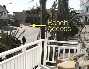 view from second floor deck: beach access location shown across street 