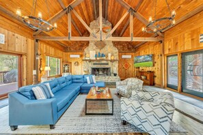 Relax in our spacious living room with cozy seating and a welcoming atmosphere.
