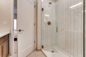 The attached master bathroom has a fantastic shower.
