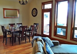 Open concept living/dining kitchen with views of the lake and mountains