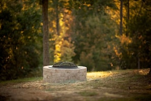 Fire pit with mountain view at White Farmhouse Cottage rental in Arkansas