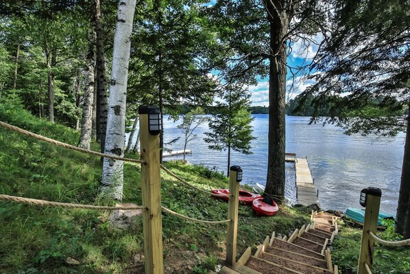 Stairs to the lake with access to the kayaks, paddle boats & fishing boat!