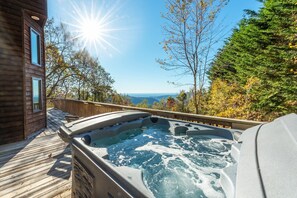 Take in the stunning mountain view from the luxurious hot tub