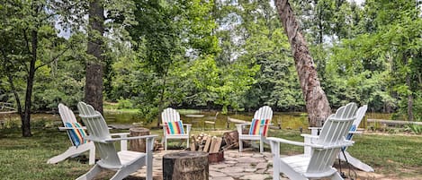 The vacation rental boasts a fire pit right on Little River.