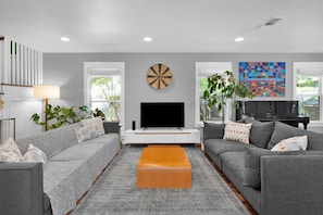Open floor plan with lots of comfy seating for socializing, sports game watching, or games