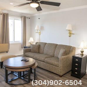 Comfortable sleeper sofa in the living area with ample space to gather around with your friends and family