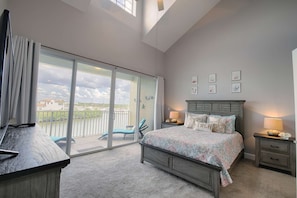 Soaring ceilings, a private balcony and an en-suite bathroom are all featured in the Queen master bedroom