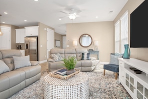 Family room featuring comfortable seating and large flat screen tv