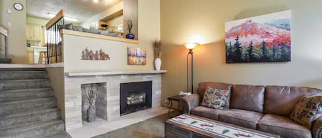 Living room with gas fireplace and flat screen TV