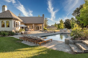 Alluring view of the pool and the main house